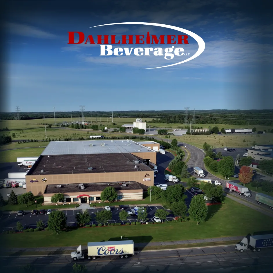 Aerial view of the Dahlheimer Beverage facility in Monticello, Minnesota, with delivery trucks on site